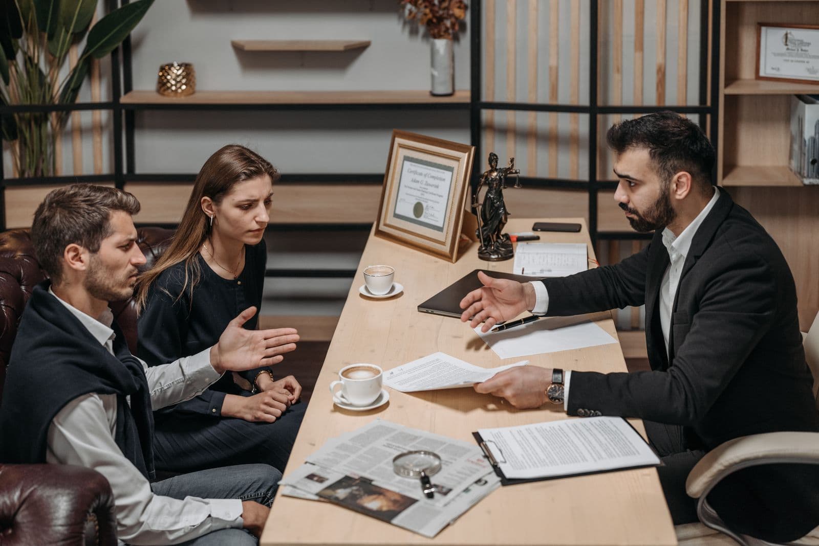Attorney consulting with clients, the kind of search intent law firm SEO targets