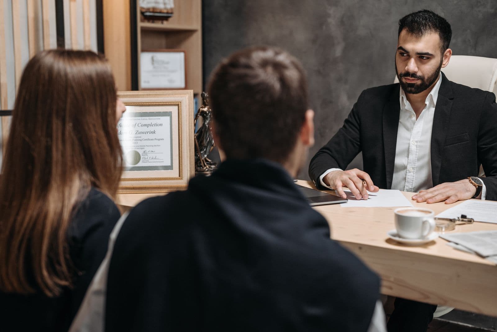 Law firm SEO in Maryland: attorney meeting clients in a law office