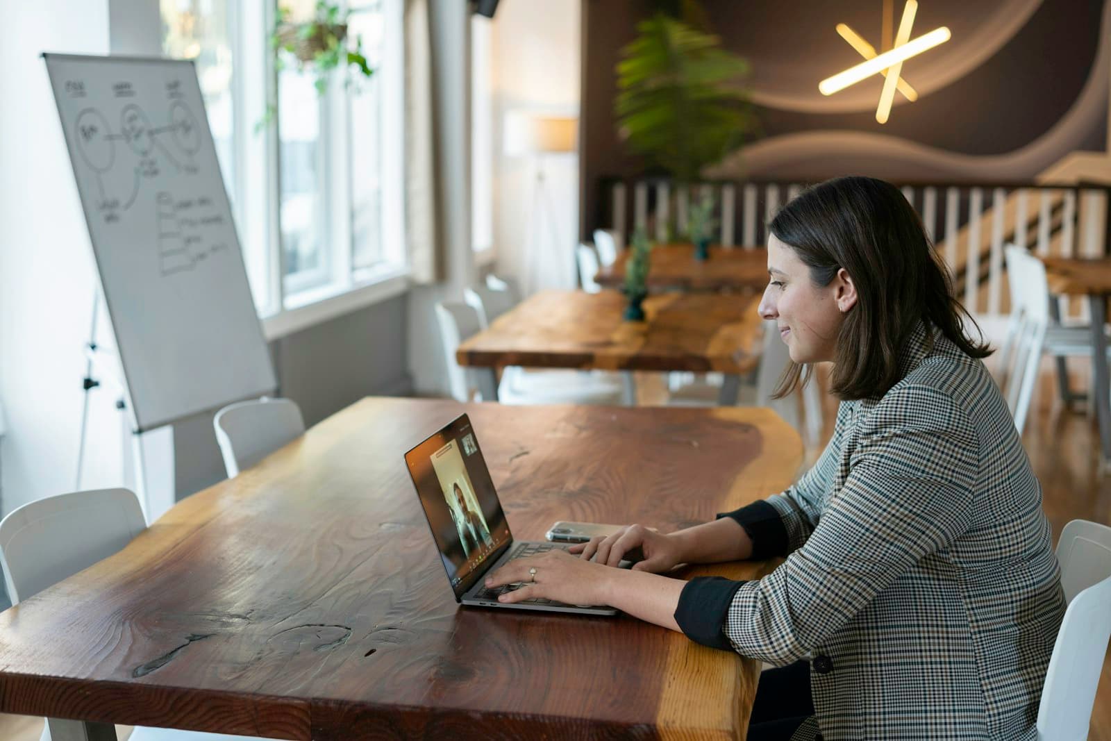 Woman on a laptop video call, like the 30-minute free SEO audit review call