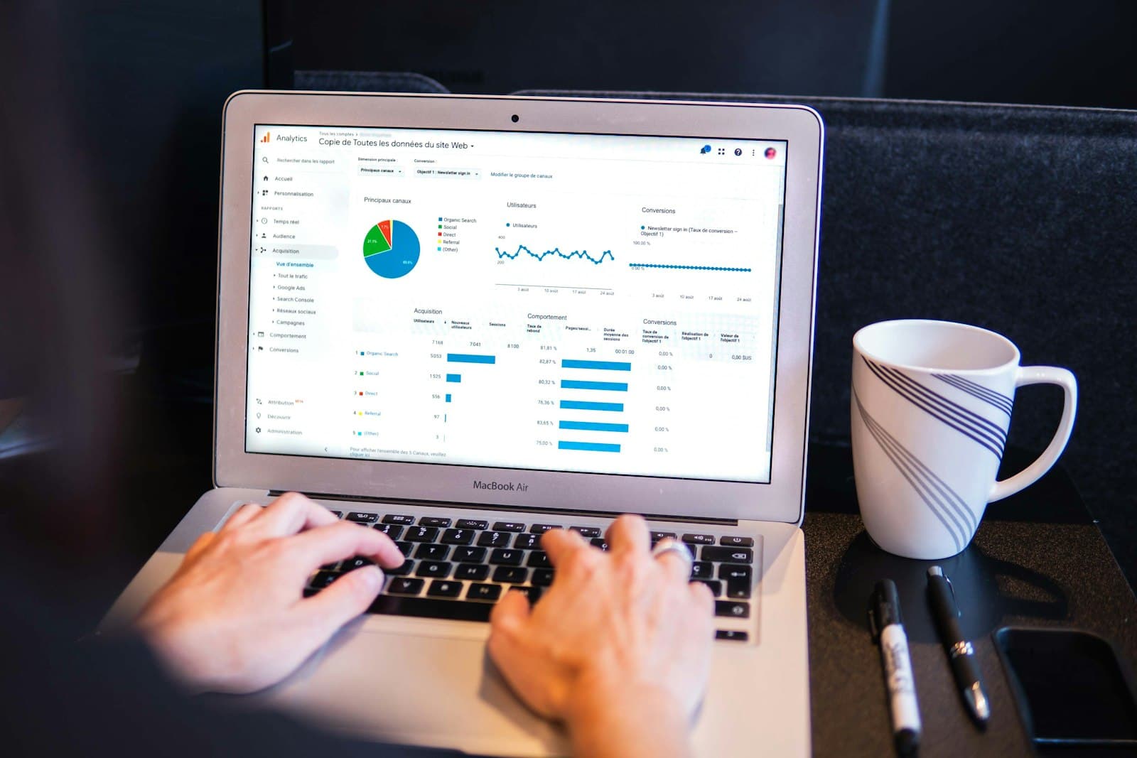 Person reviewing a website on a laptop during a free SEO audit