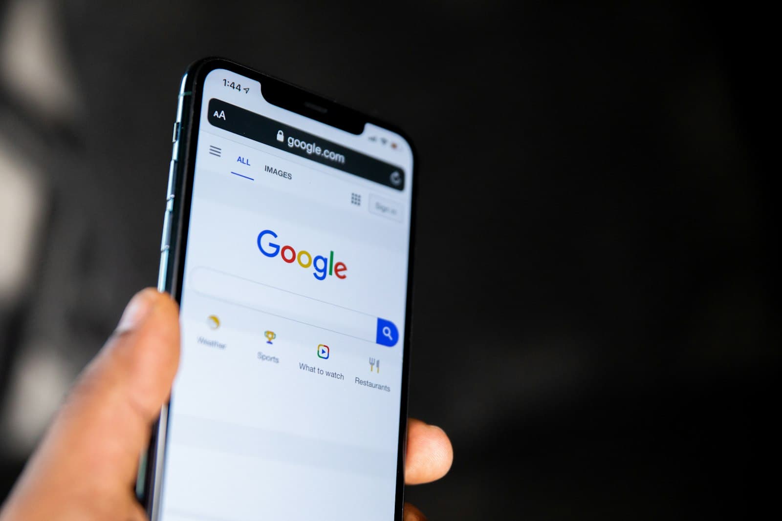 Google Ads management Maryland: a customer starting a Google search on a phone